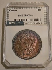 1884-O Morgan Silver Dollar PCI Slab Spectacular Rainbow Toned 0.7734 oz BU