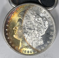 1884-O Toned Morgan Dollar. $1. Spectacular Obverse Rainbow Colors.